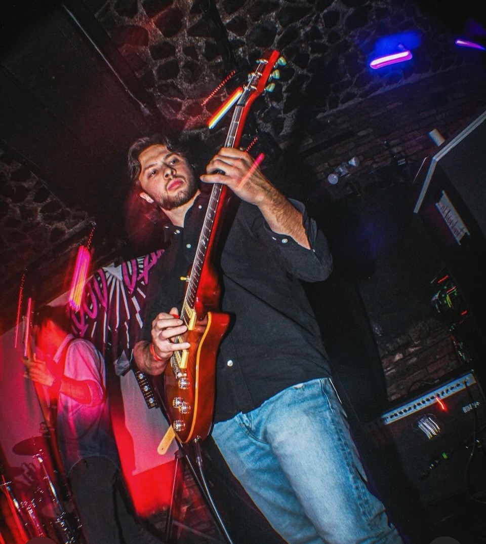 AJ playing guitar